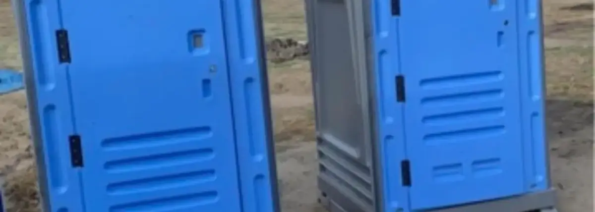 Blue porta potties on a construction site